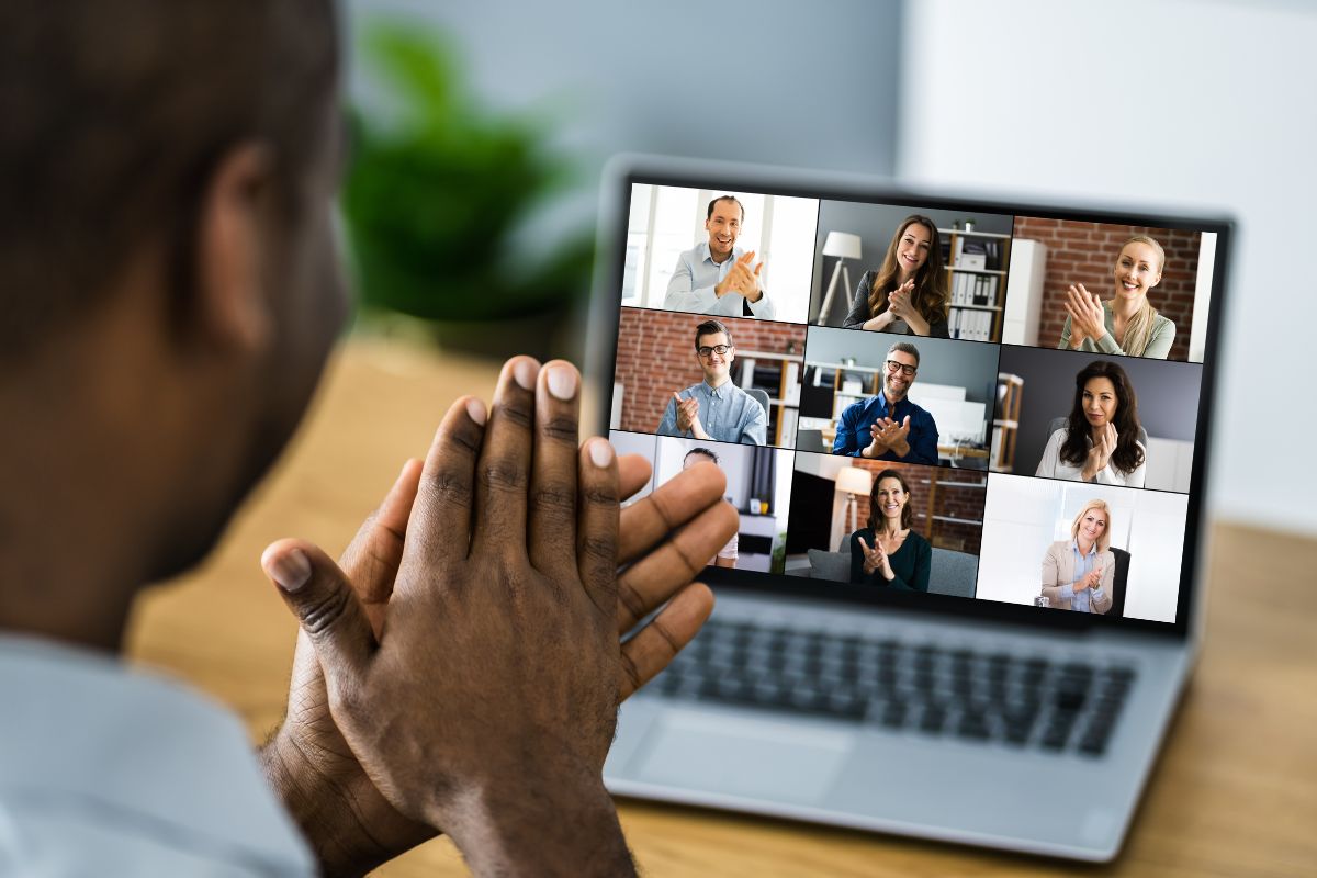 A guy getting swag gifts in her virtual team meeting