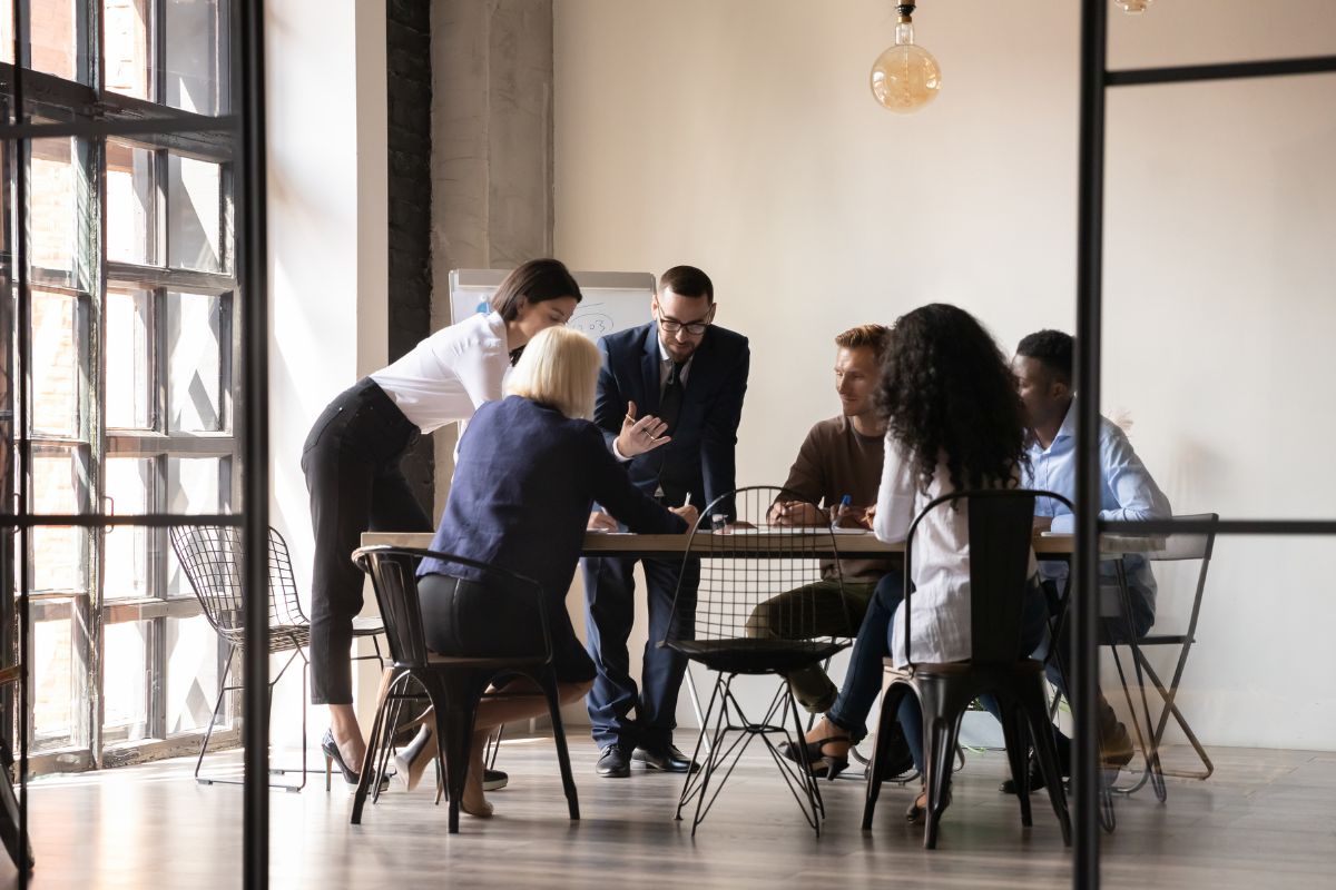 A team of employees talking to each other