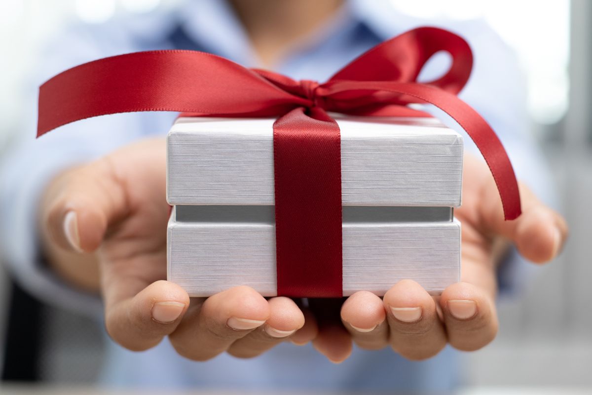 An employee holding his gift