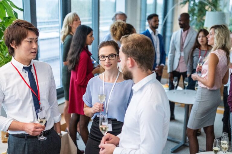 Employees in an event waiting for their swag giveaways