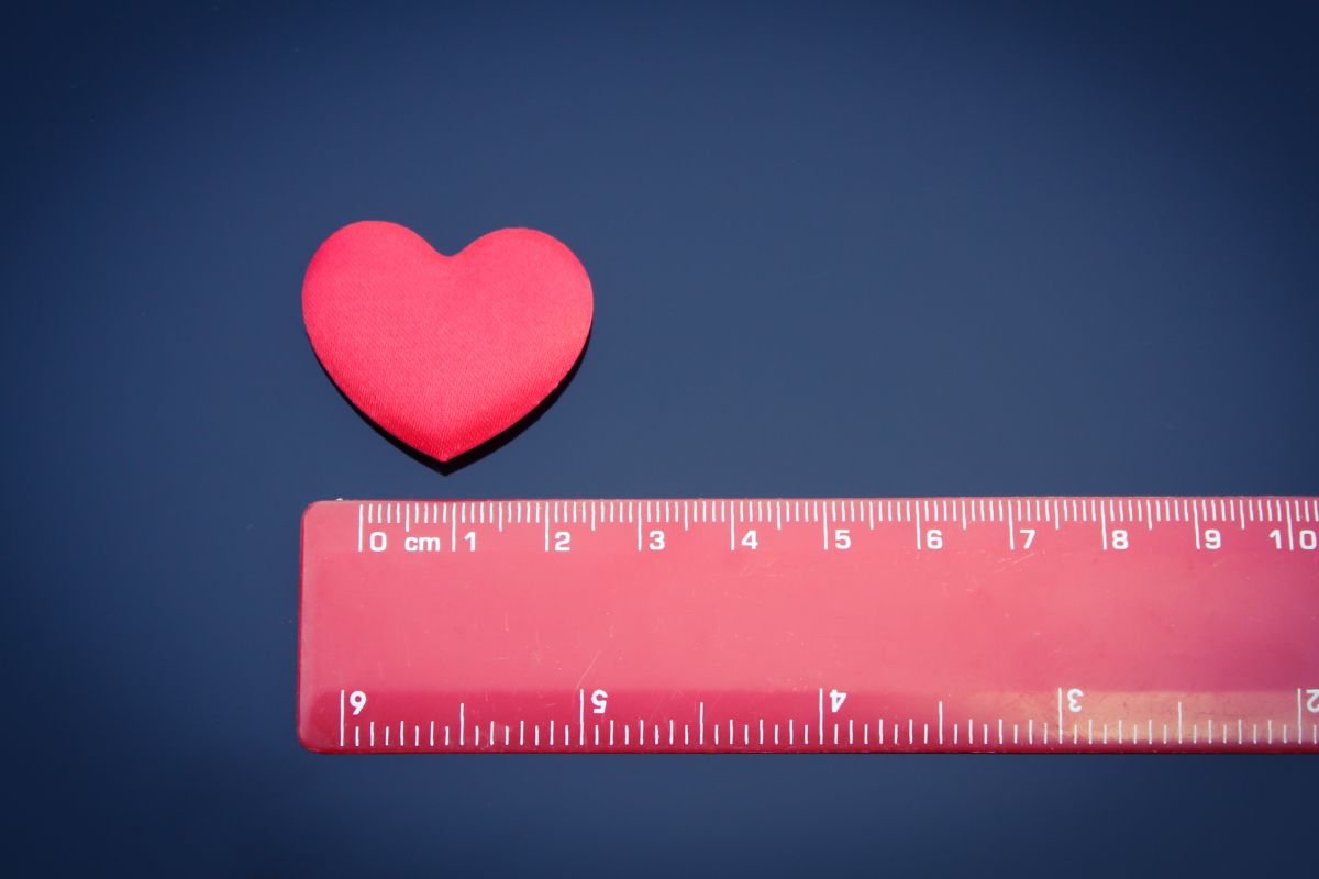 A heart shaped sticker accompanied by a scale