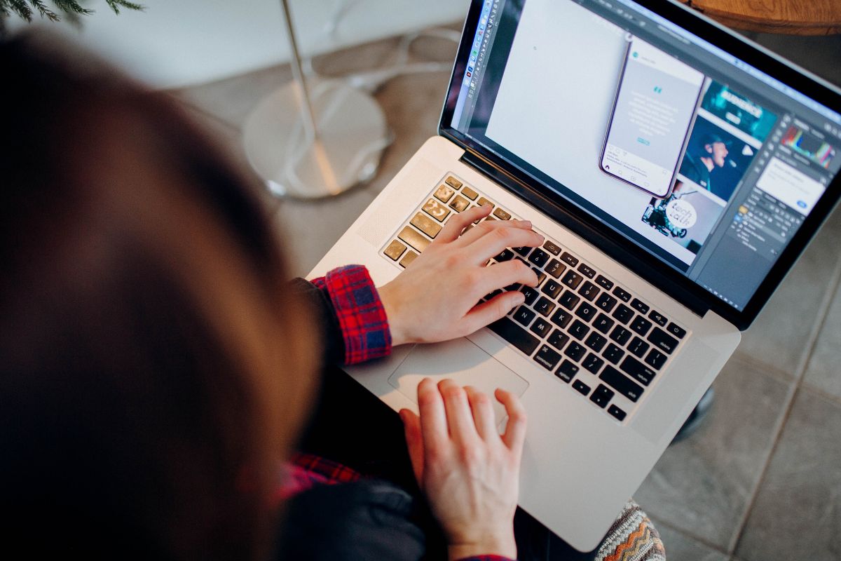 A lady using vector images on her laptop