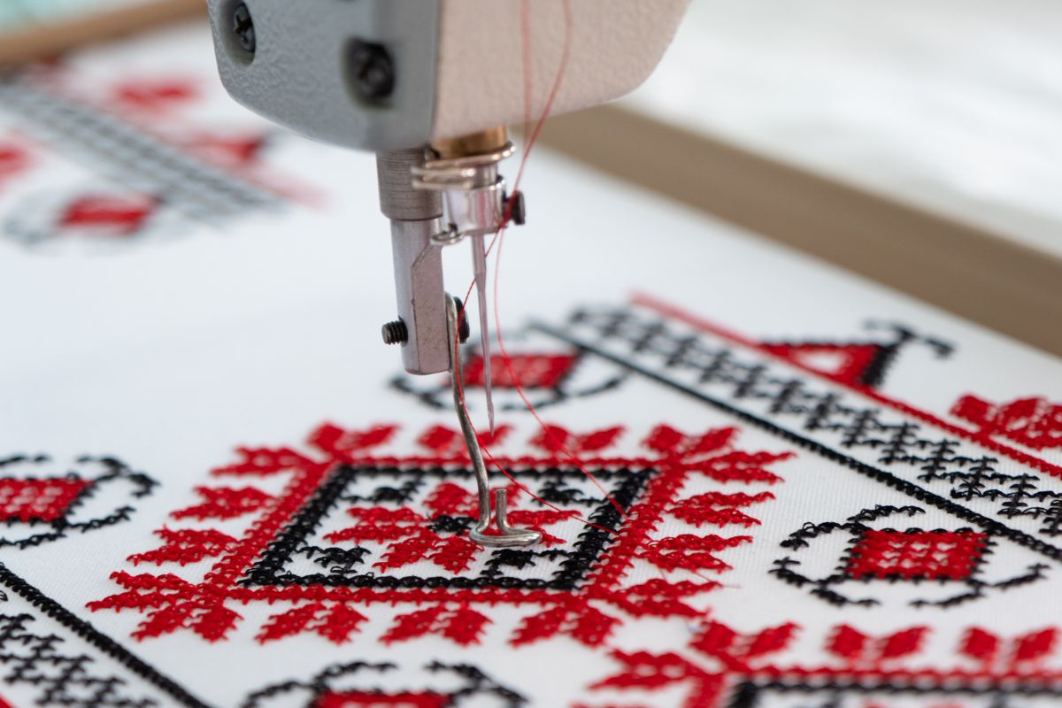 An embroidery machine crafting design on the cloth