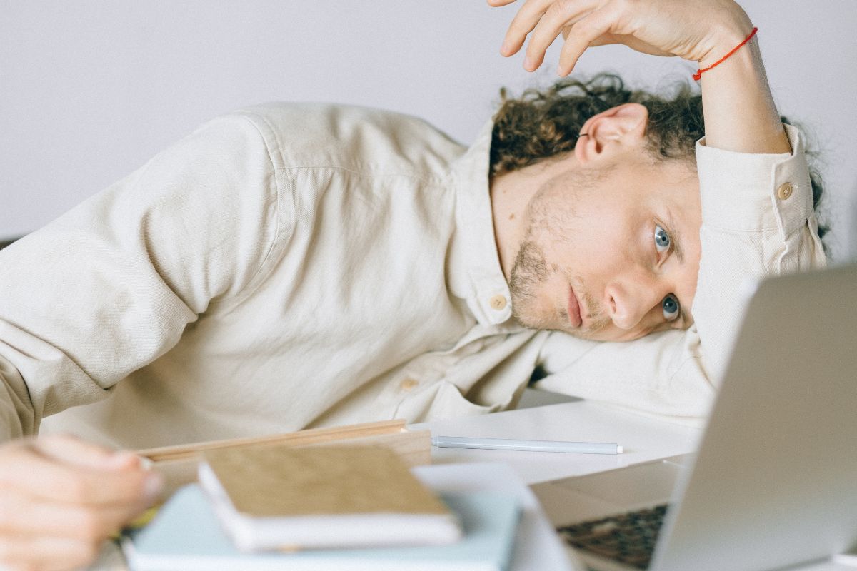 An employee feeling tired after getting too much work from seniors