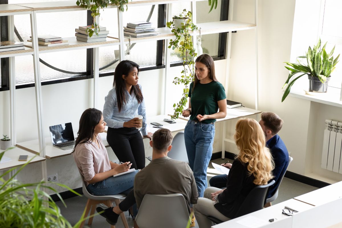 An office team interacting with each other in a problem solving session