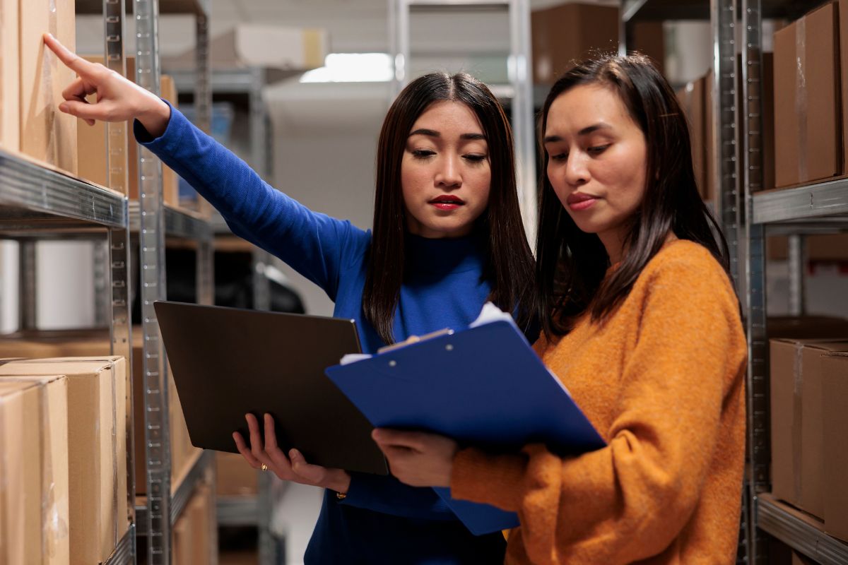 Business owner and her employee checking proper supplies available to them