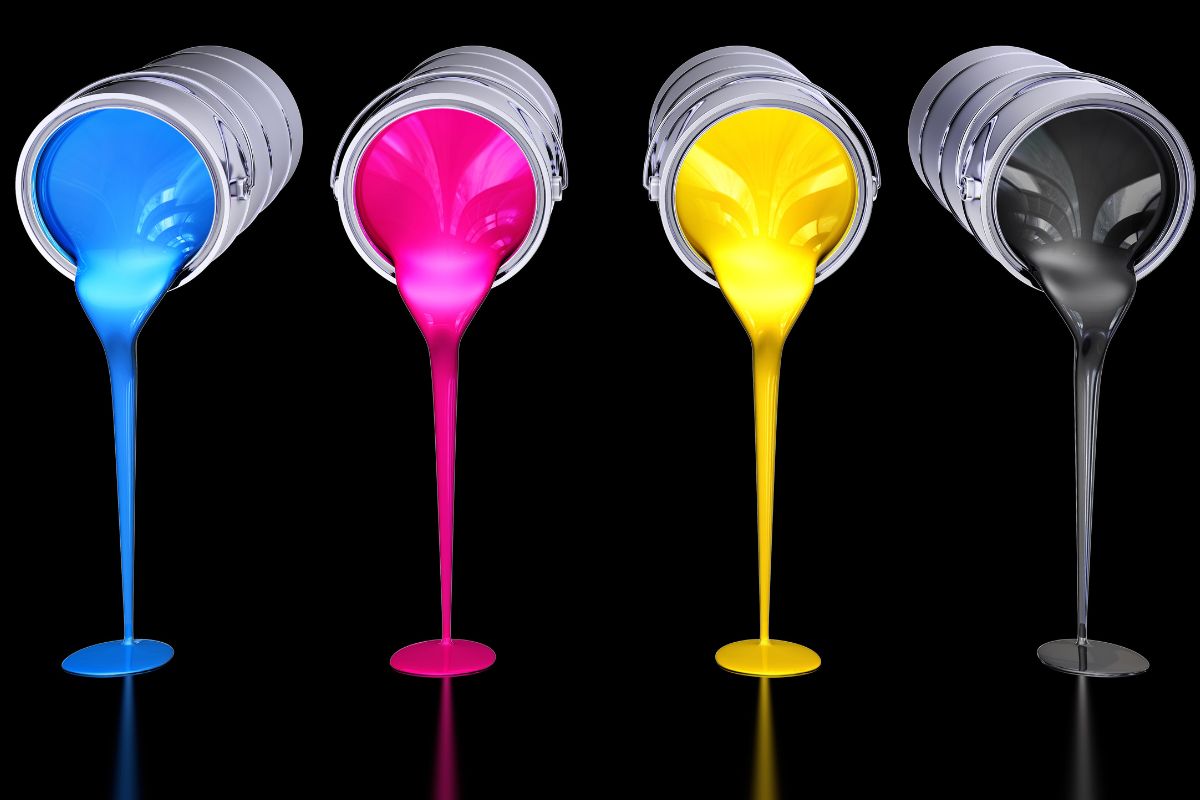 CMYK color pouring from 4 containers in the picture