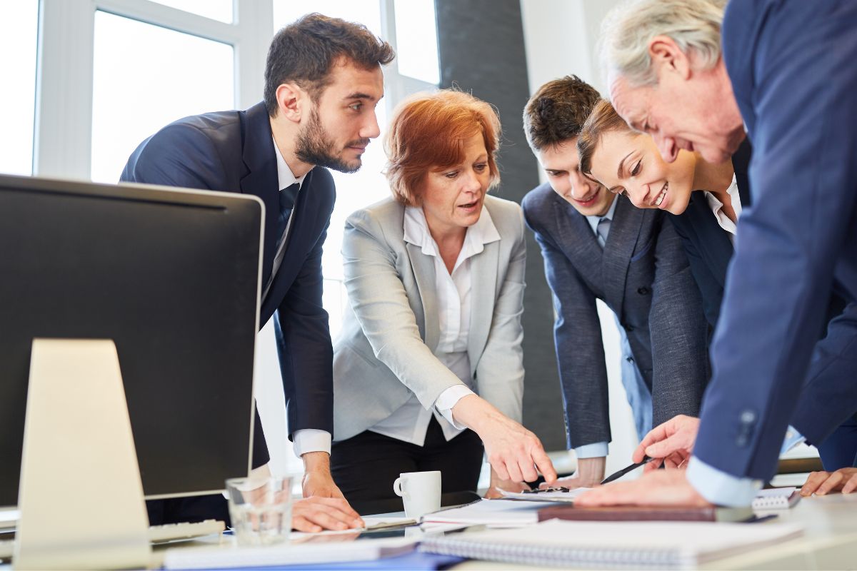 Employees discussing ideas about custom swag for small business