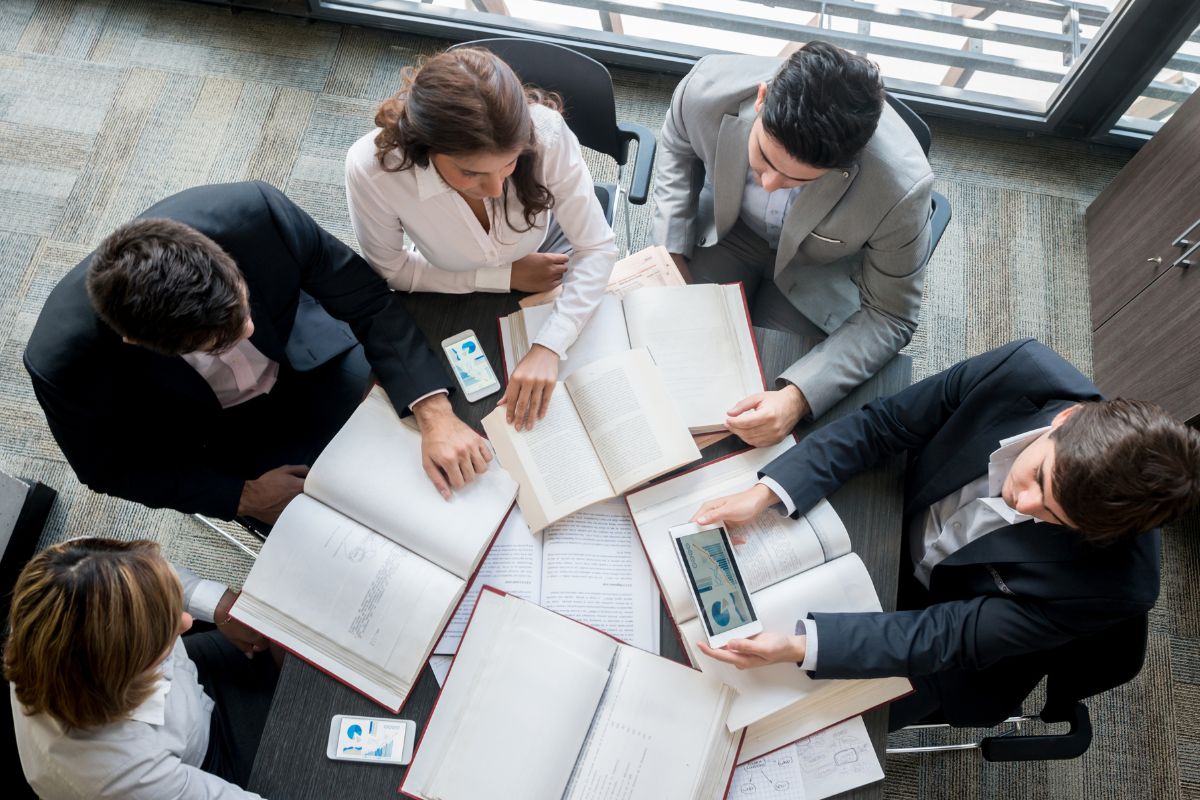 Employees discussing plans to grow swag store online