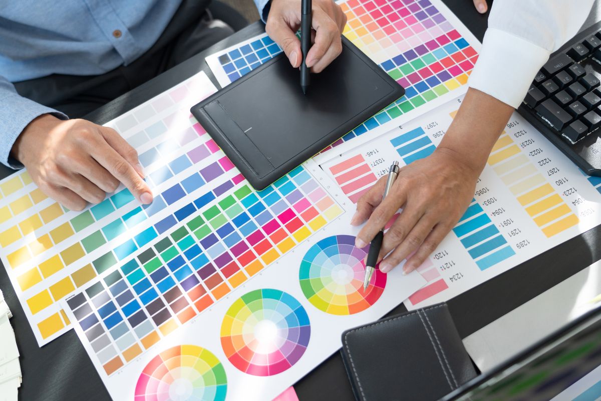 Graphic designer working on tablet to convert pantone to hex colors