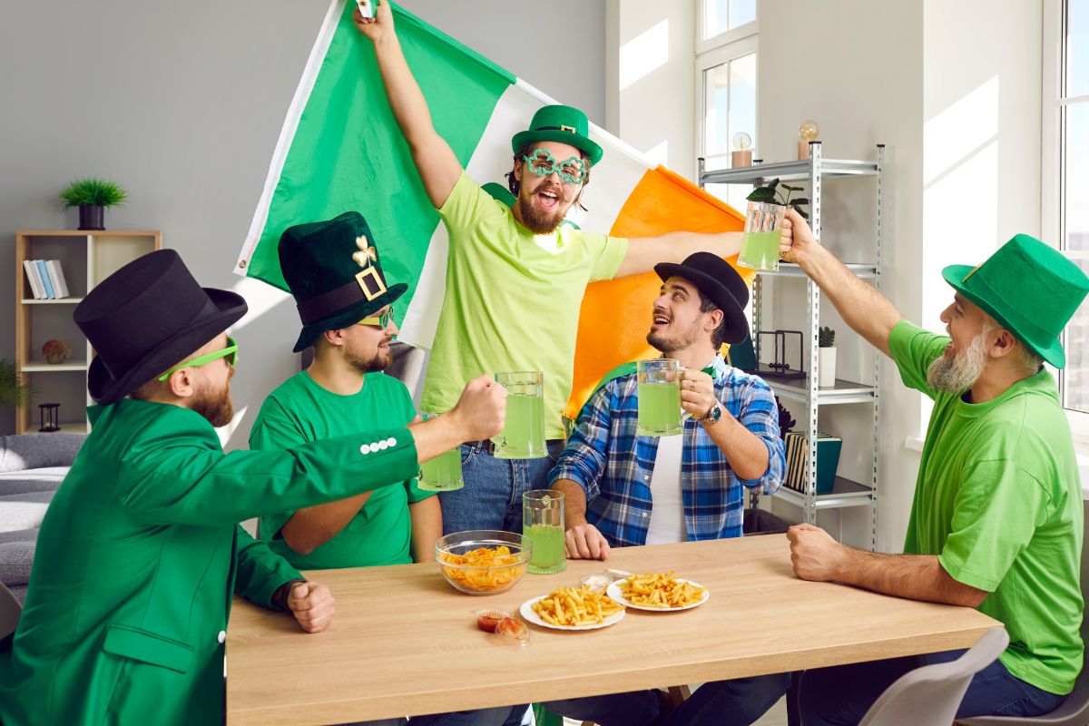 Group of people celebrating St patricks day wearing T shirts at home