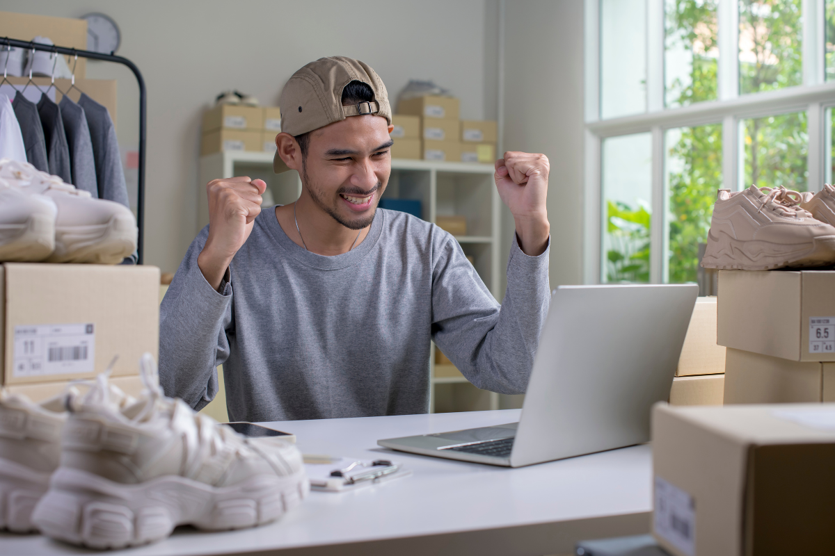 Happy man running online swag store from home