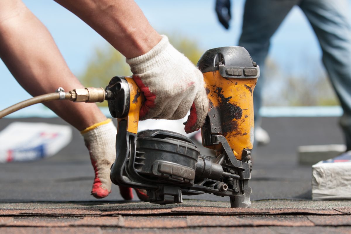 Man Installing signage board