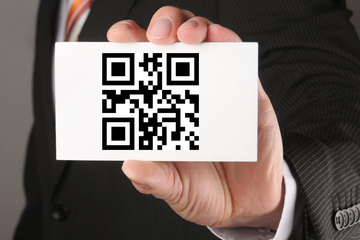 Man holding QR code business card