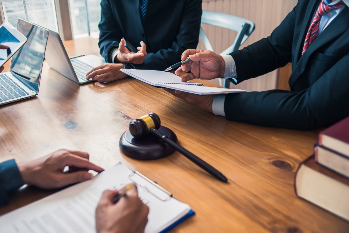 Men discussing legal aspects of client holiday gifts