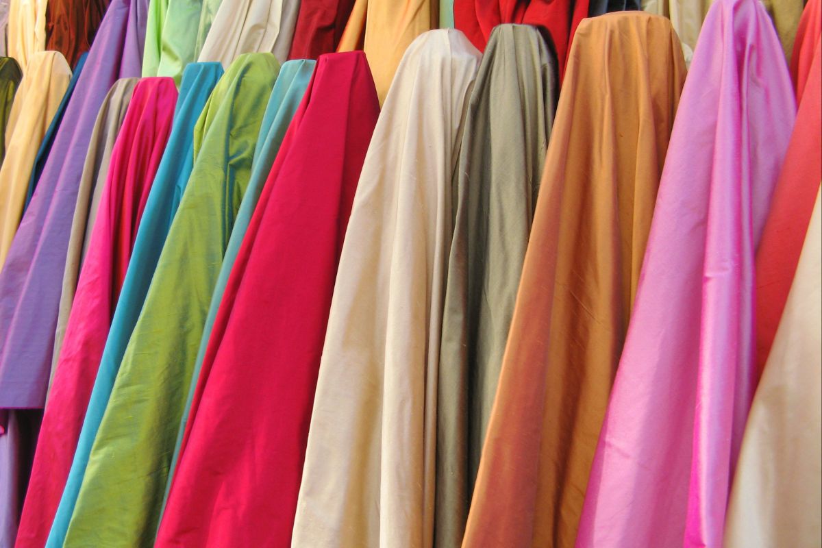 Polyster dresses hanging in a manner to avoid shrinkage