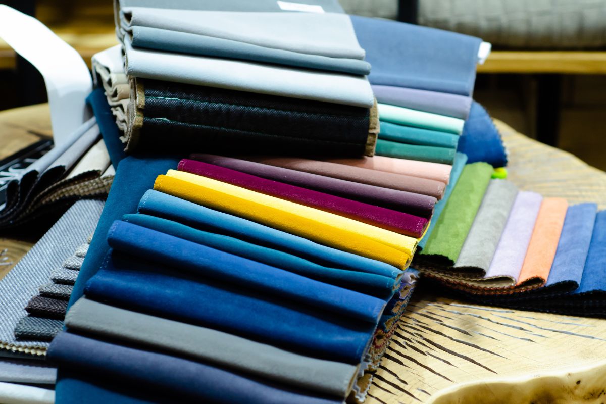 Various types of fabric on a wooden table