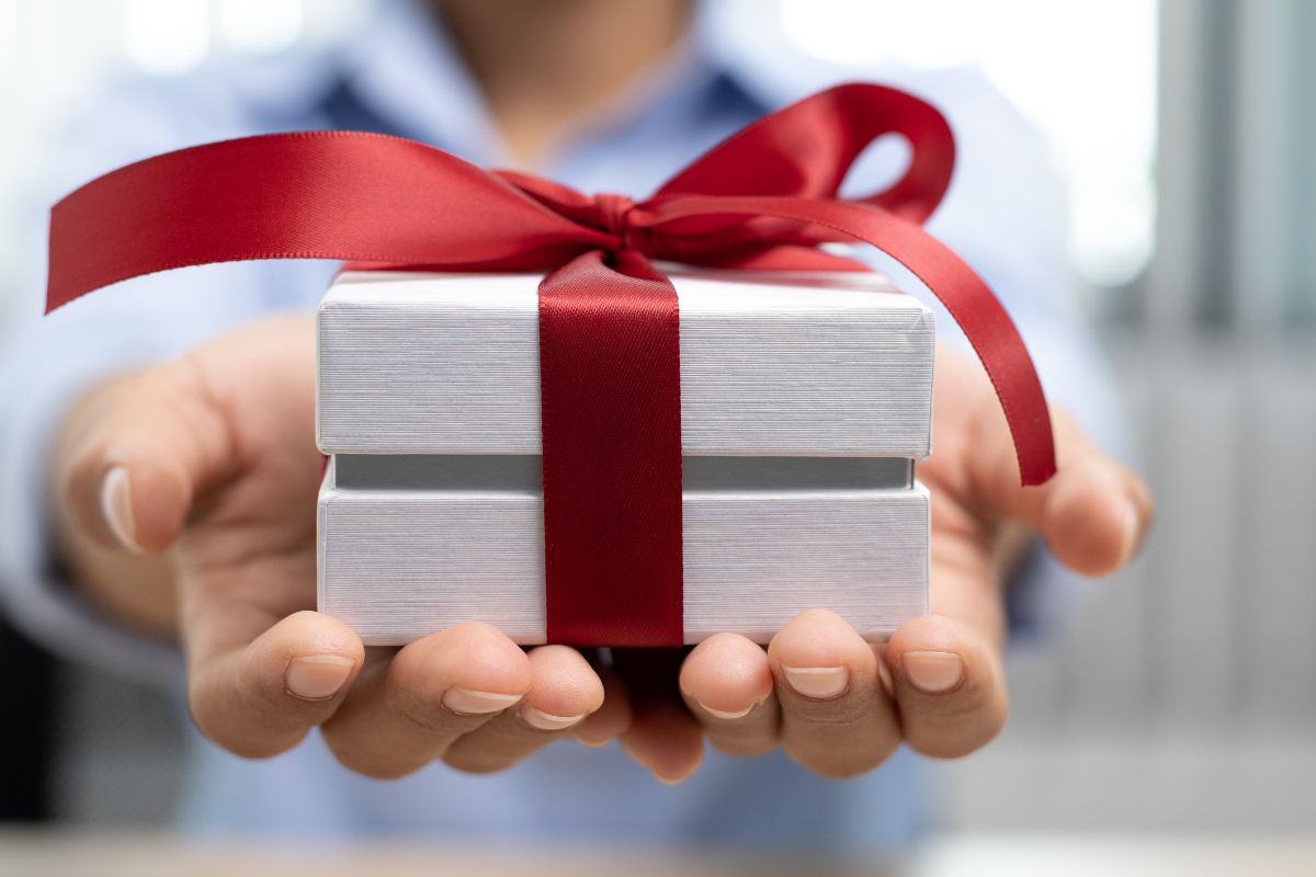 Woman employee holding custom swag gift