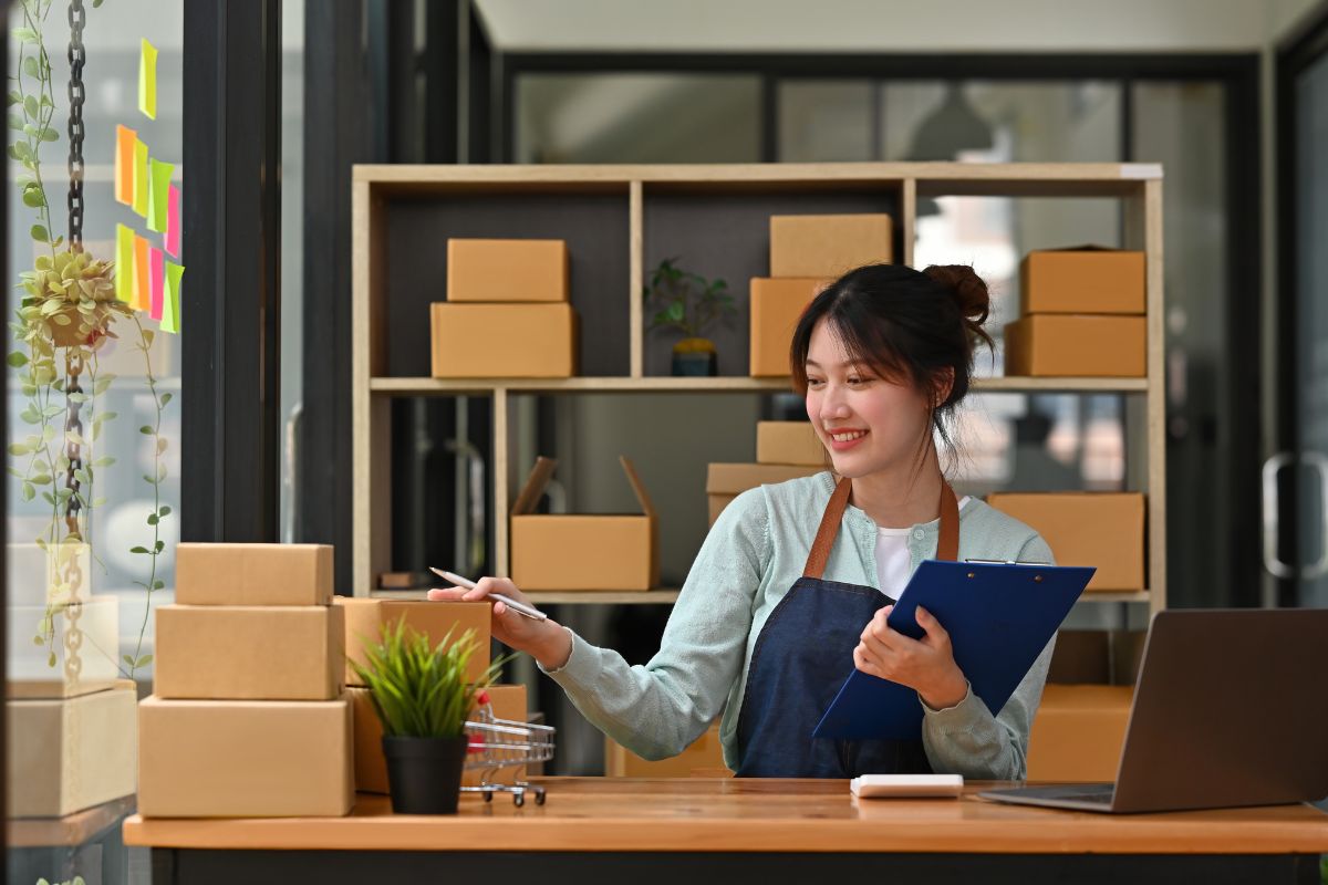 Woman inspecting inventory to sell on ebay