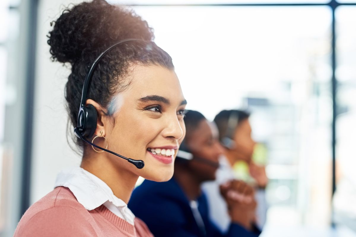 Woman wearing headset helping customer to sell on ebay