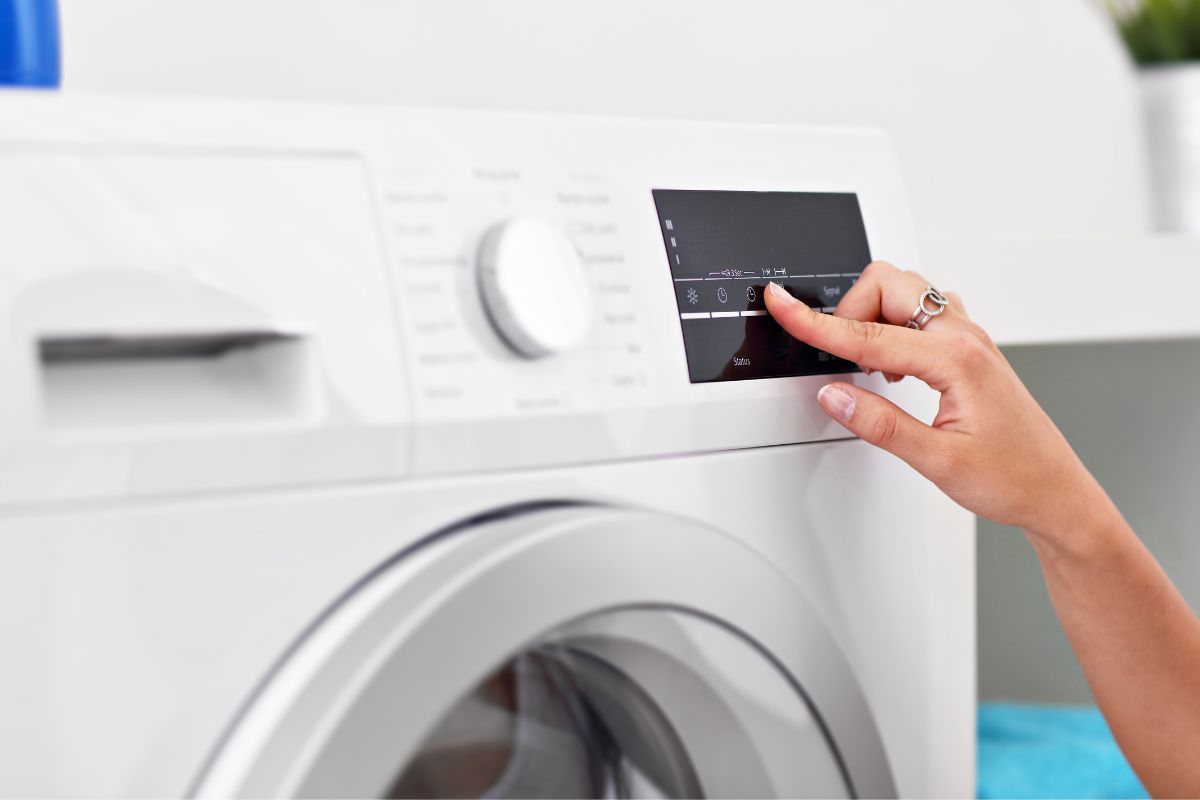 Women adjust to mild wash cycle to prevent shrinkage of polyester fabric 