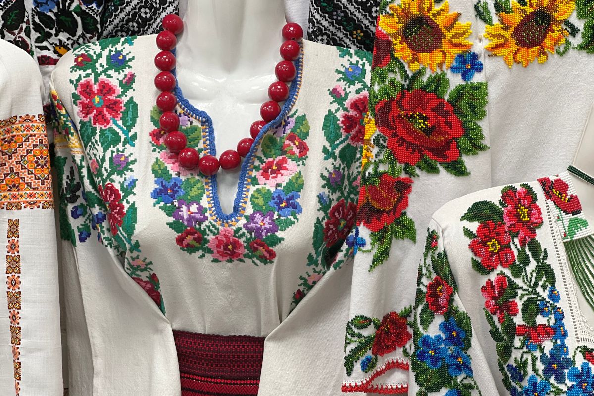 A kurta with embroidery paired with red neck accessories