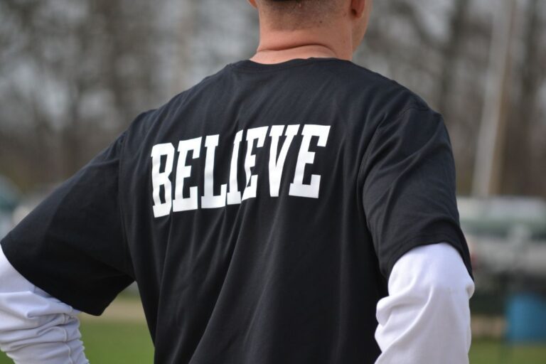A man in a black t shirt with a white logo