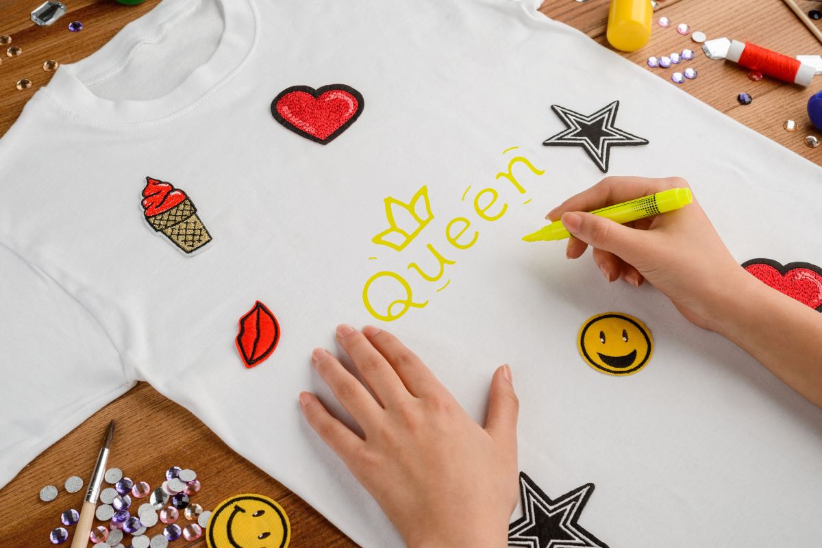A person customizes a t shirt to get a trendy look