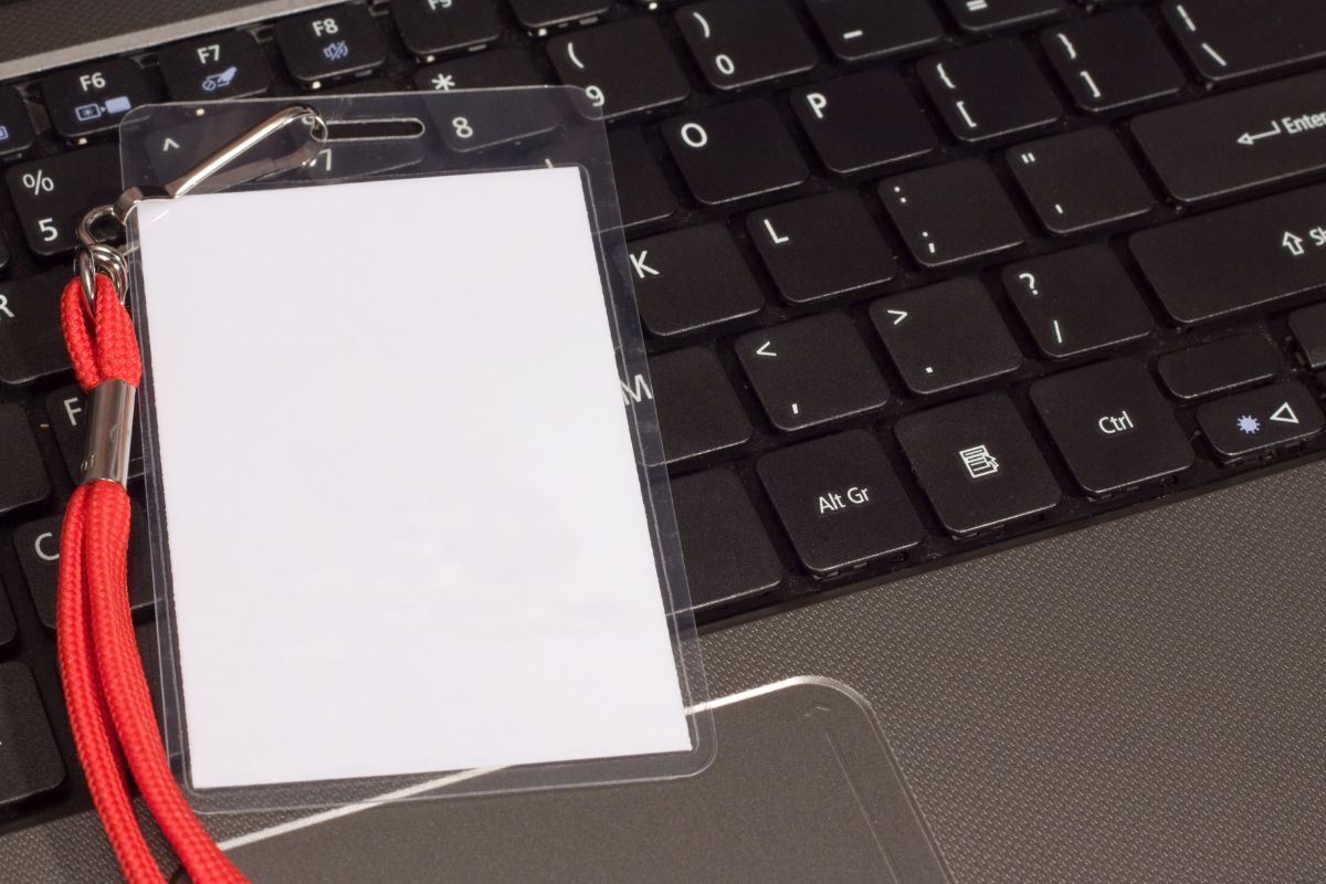 A tubular lanyard kept above laptop.