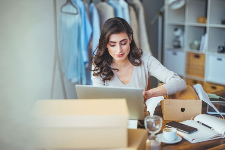 A woman working from home explores how to launch a small clothing business from her home