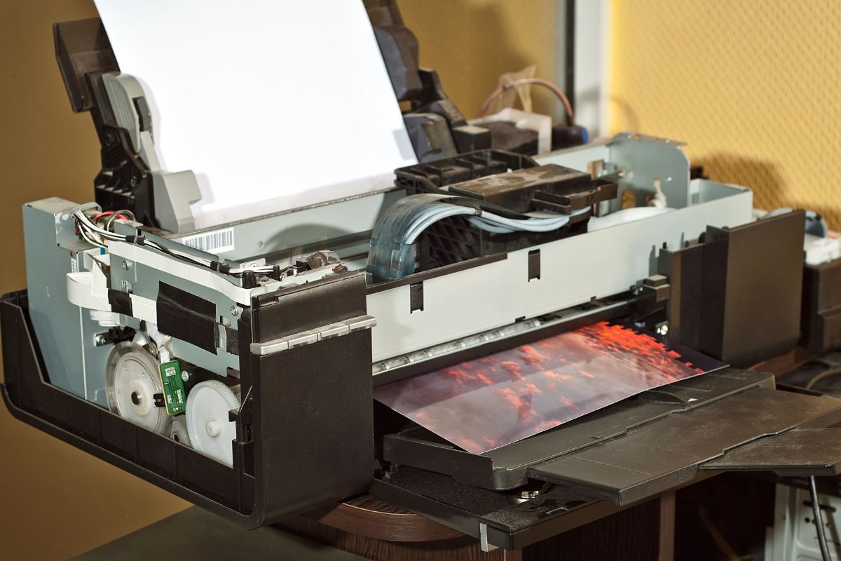 Printing machine producing an art design showing the process of how to make prints of your art