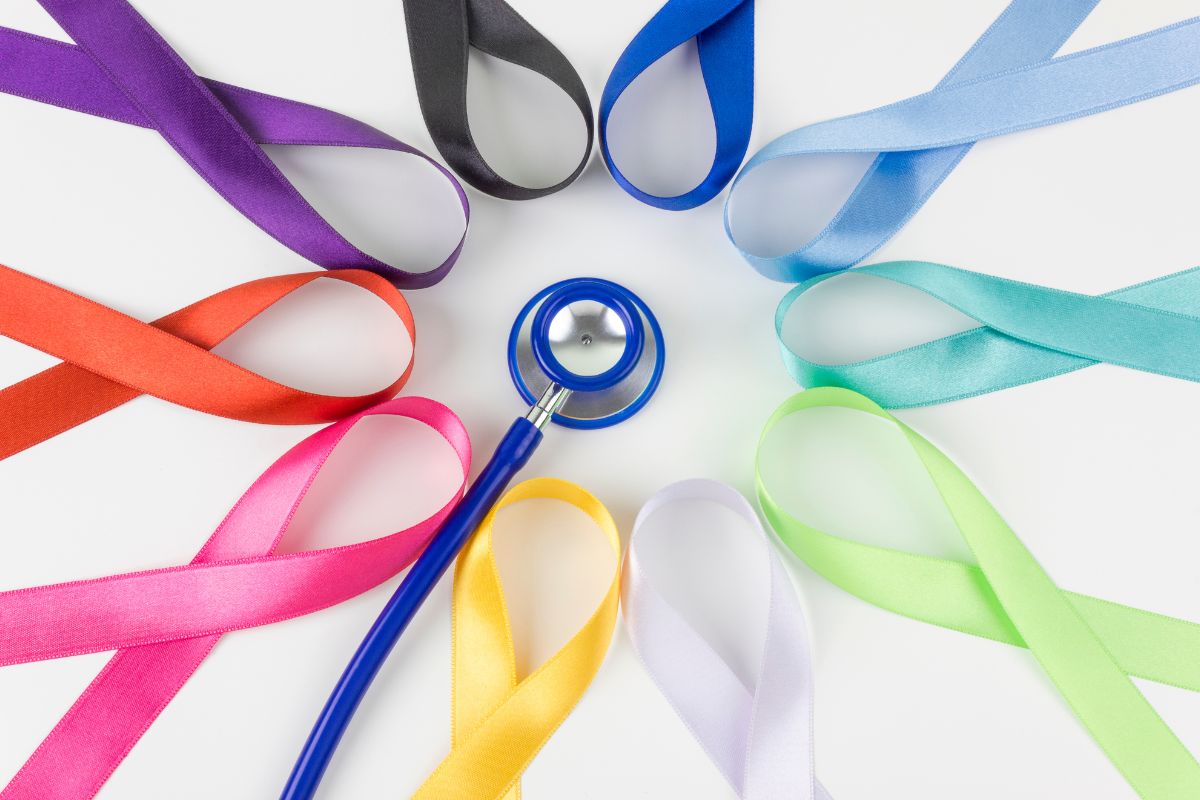 Stethoscope with colorful ribbons on white background