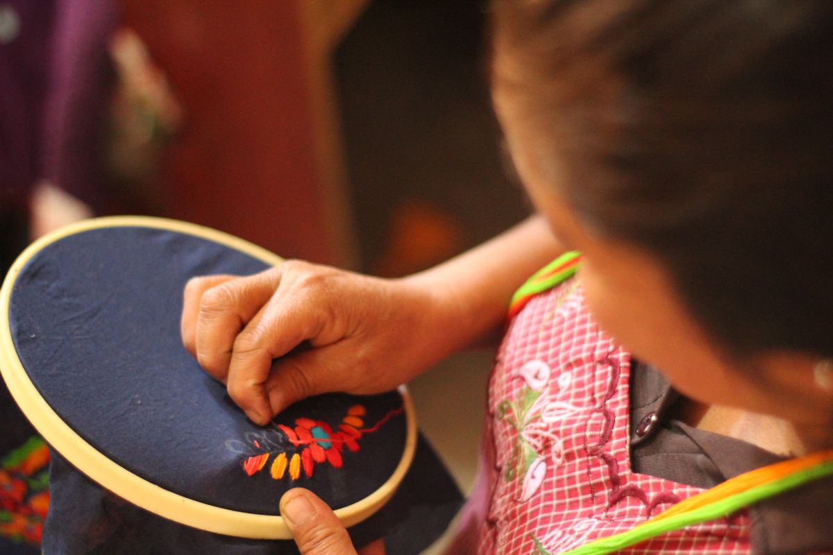 Woman doing hand Embroidery