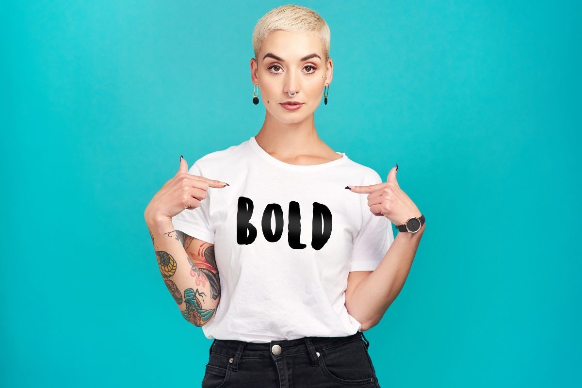 Woman points to her trendy t shirt design