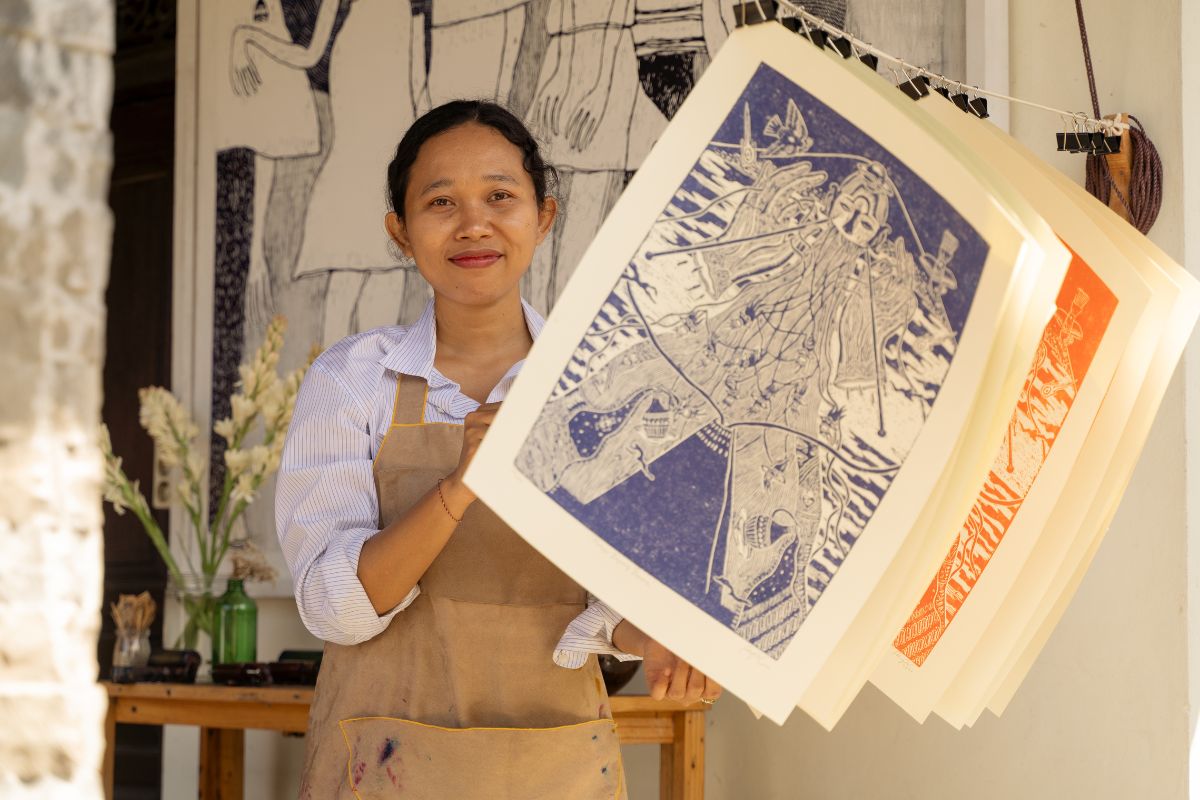 Woman protecting her printed artwork