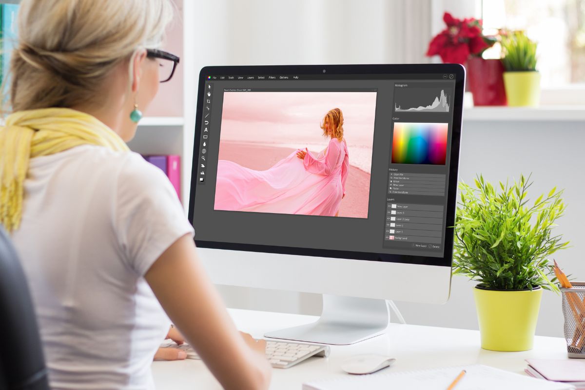 Woman working on designing software on computer for clothes