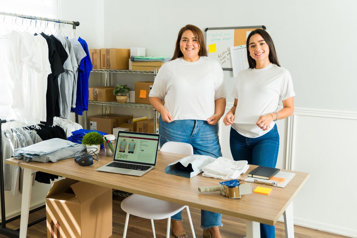 Women retailing custom T shirts in a store