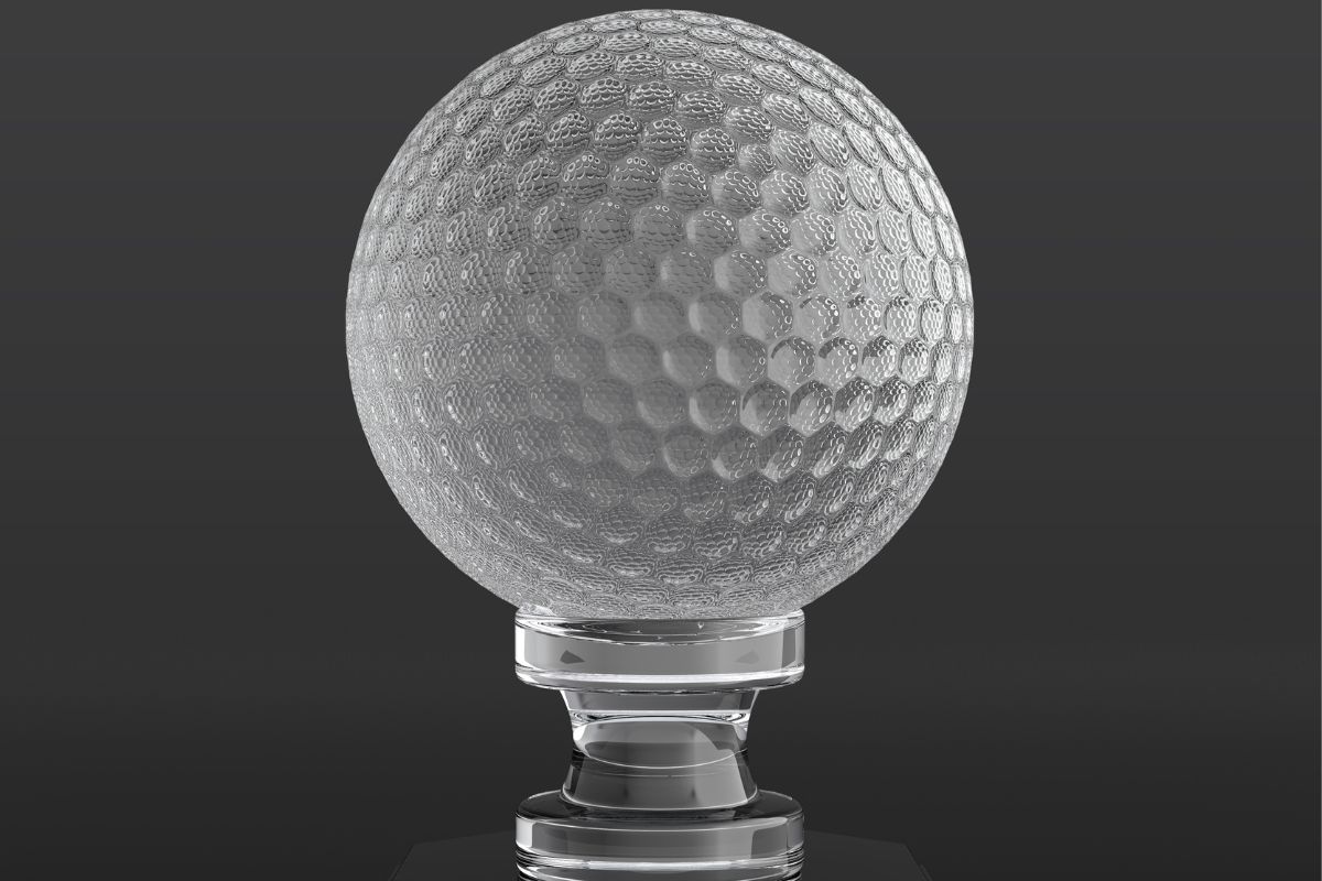 A beautiful golf prize with a trophy and a golf ball at the top of it