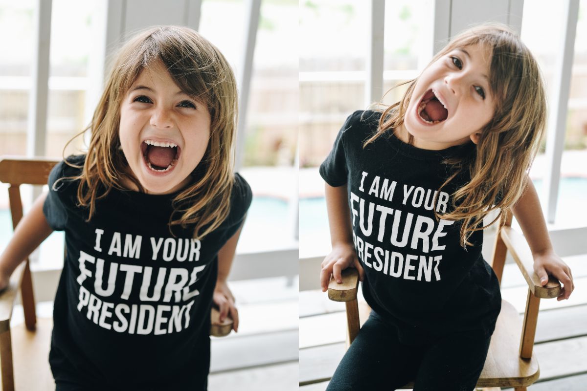 A child wearing t shirt on which i am your future president is written