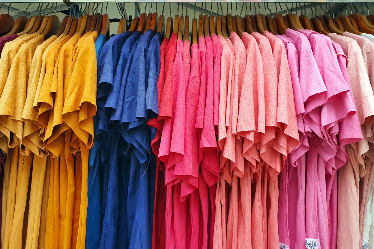 A collection of cotton t shirts hanging at the store