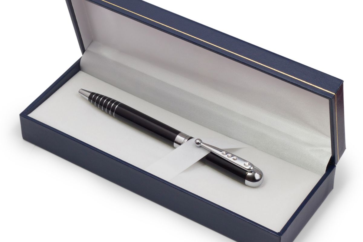 A customized pen for an employee as a gift in a box.