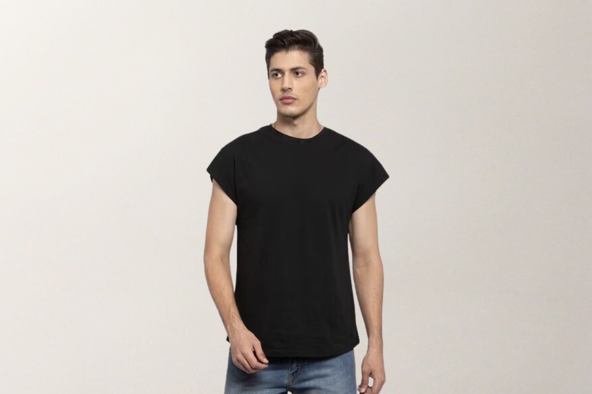 A guy wearing a cap sleeve black color t shirt