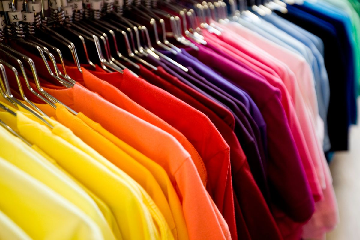 A huge collection of different sized colored t shirt shown in the picture