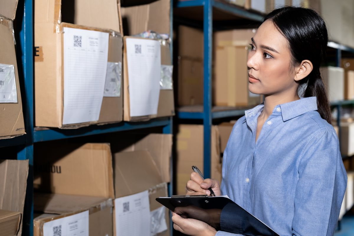 A lady managing inventory for promotional items at companys warehouse