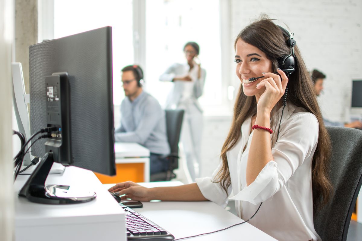 A lady providing customer support to the client for their query