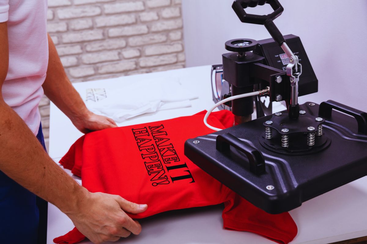 A person printing t shirt with some quotes