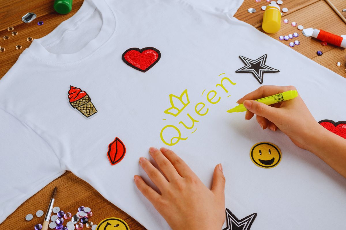 A woman customizing her fitted T shirt