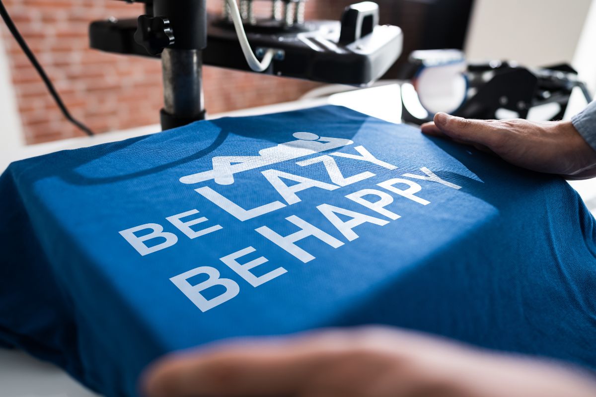 Be happy Be lazy printed on a shirt using a machine