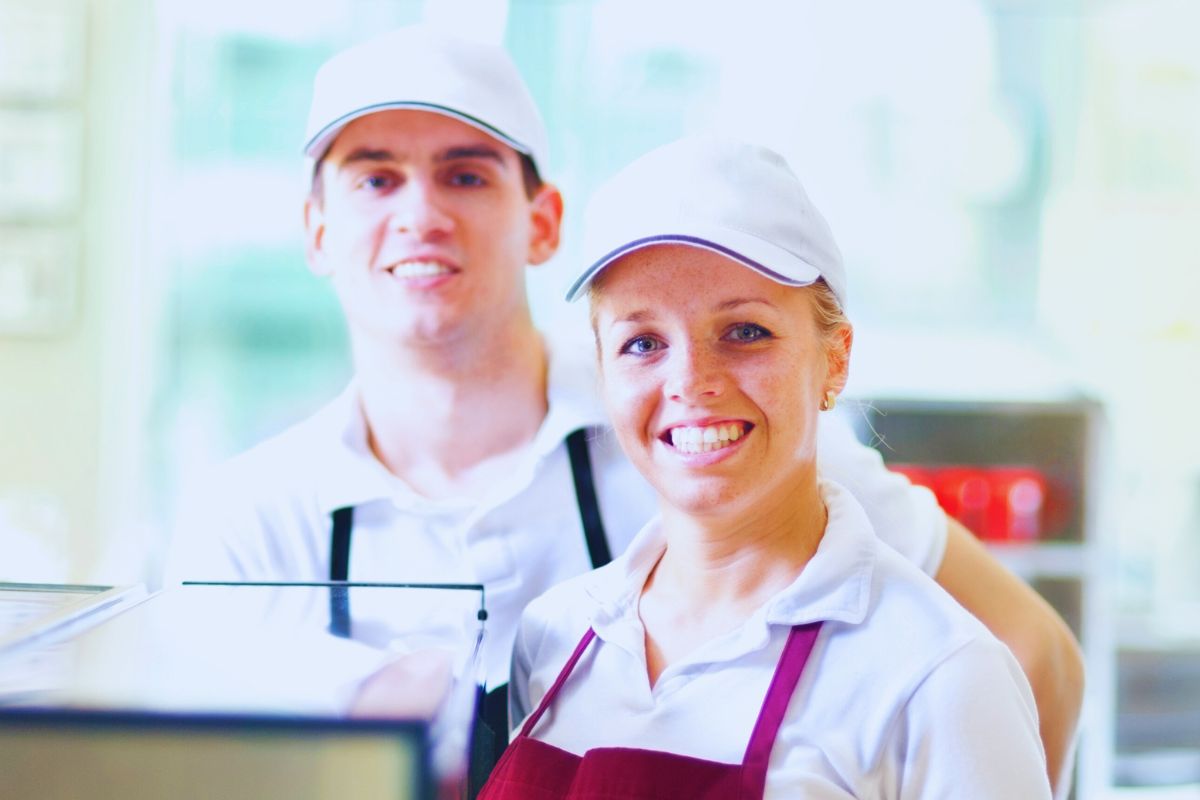 Couples wearing restaurant t shirts