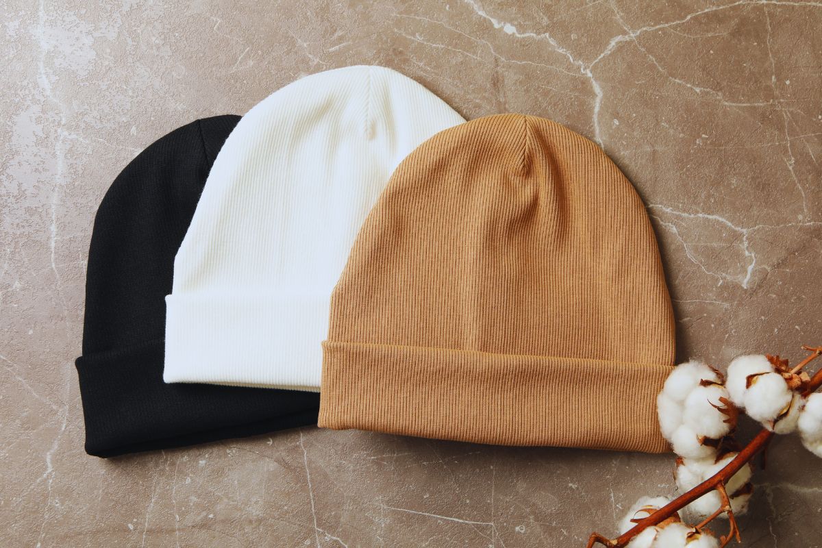 Different colored beanie kept with each other.